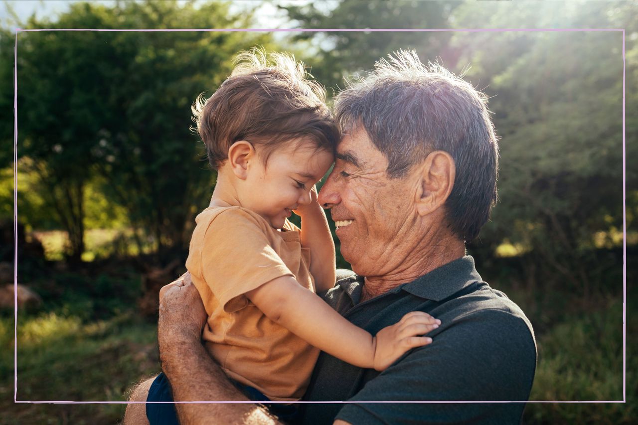 Grandfather with his grandson in a park