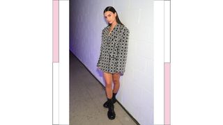 Emily Ratajkowski wears an oversized blazer/dress as she attends the Jonathan Simkhai show during New York Fashion Week: The Show at 180 Maiden Lane on February 10, 2023 in New York City.