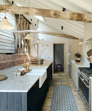 deVOL kitchen with exposed brick backsplash