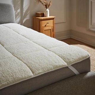 Dunelm mattress enhancer on a bed