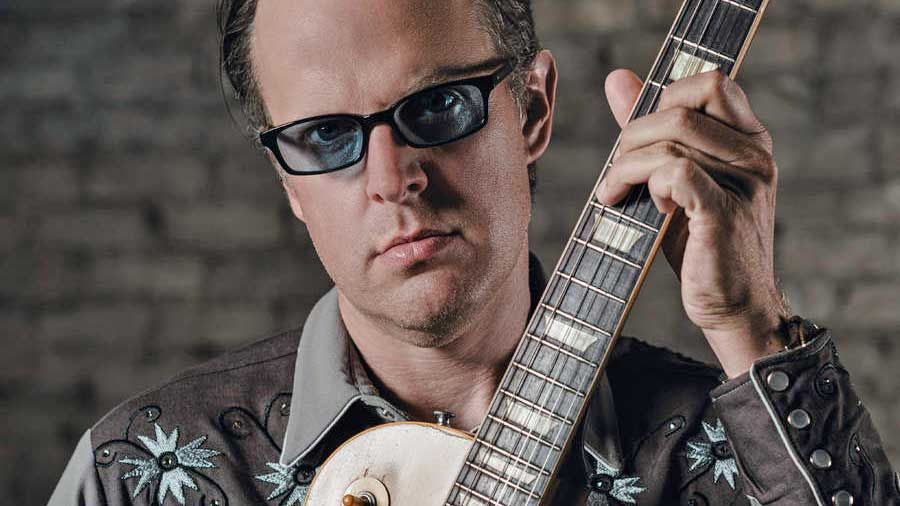 Joe Bonamassa holding a guitar