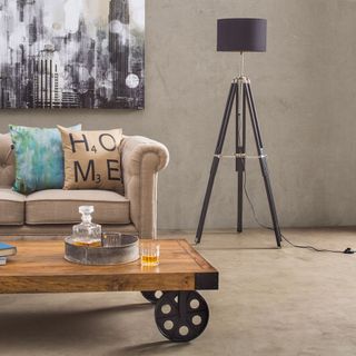 living room with grey wall wooden trolley table brown sofa and brown floor