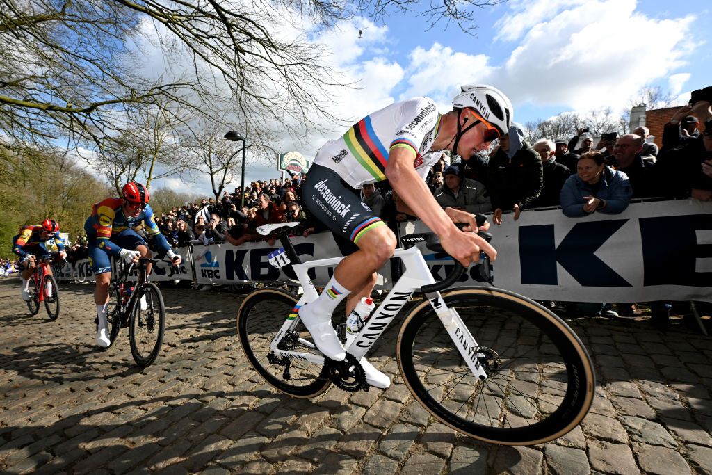 WEVELGEM BELGIUM MARCH 24 Mathieu van der Poel of The Netherlands and Team Alpecin Deceuninck competes in the chase group passing through the Kemmelberg Belvedre cobblestones sector during the 86th GentWevelgem in Flanders Fields 2024 Mens Elite a 2531km one day race from Ieper to Wevelgem UCIWT on March 24 2024 in Wevelgem Belgium Photo by Tim de WaeleGetty Images