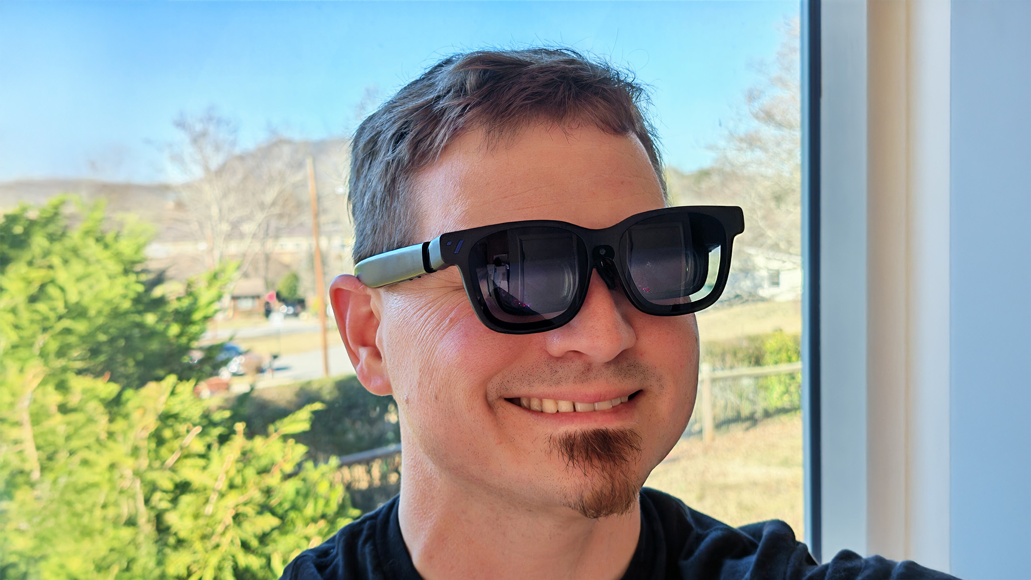 Wearing a pair of Viture Beast smart glasses