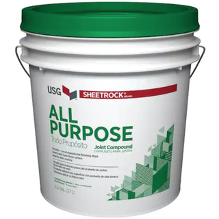 a white and green tub of All Purpose Ready-Mixed Joint Compound