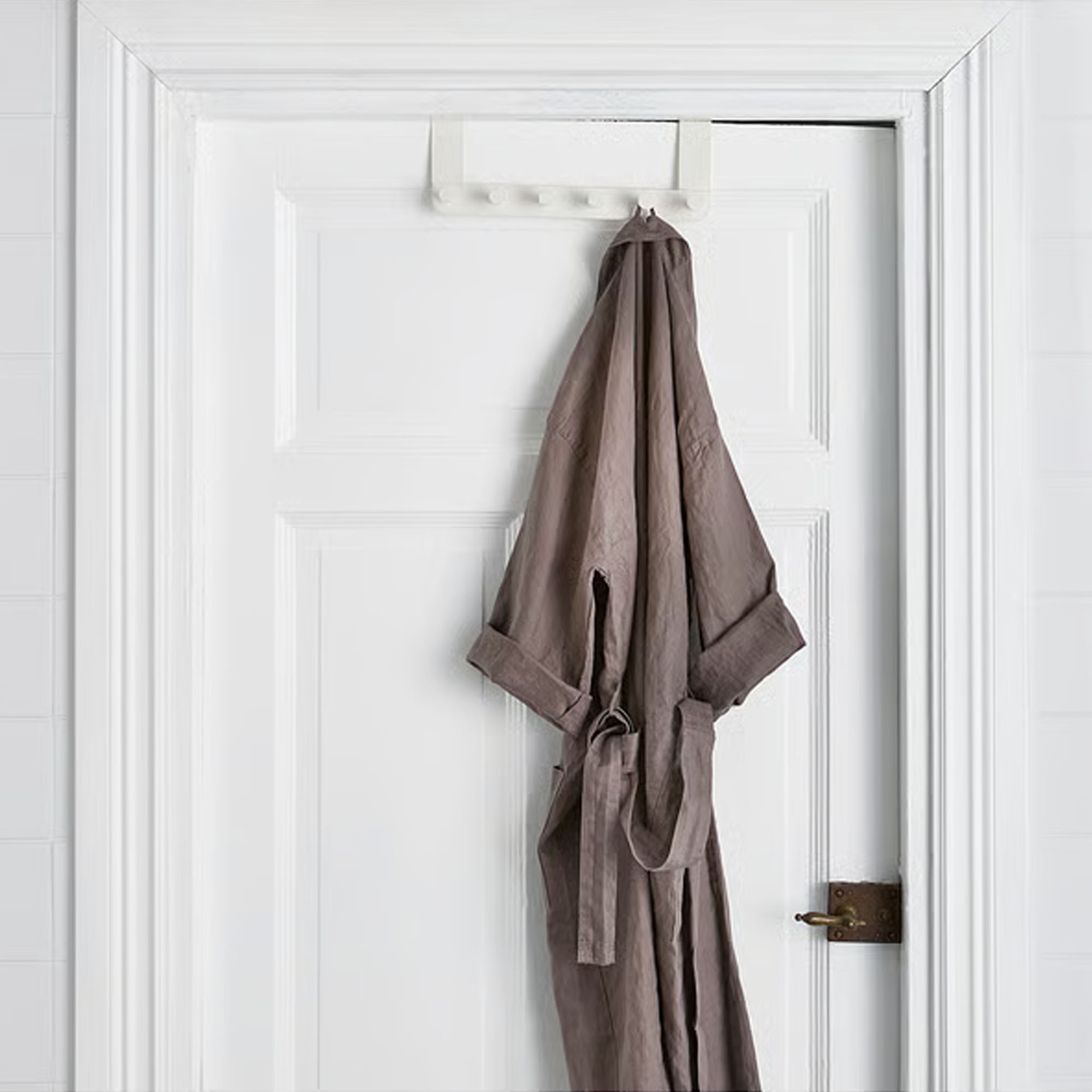 IKEA ENUDDEN hanger for door holding a brown dressing gown