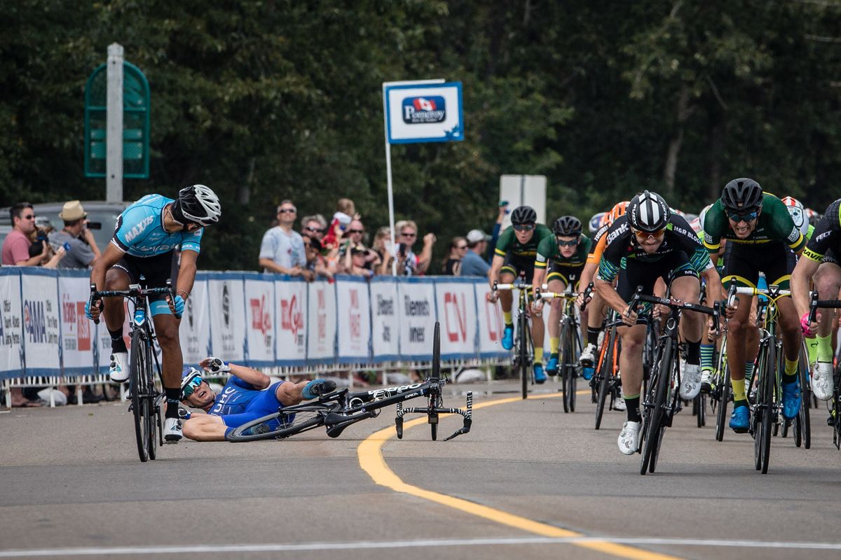 Travis McCabe hits the deck in a crash during stage 2 at the Tour of Alberta