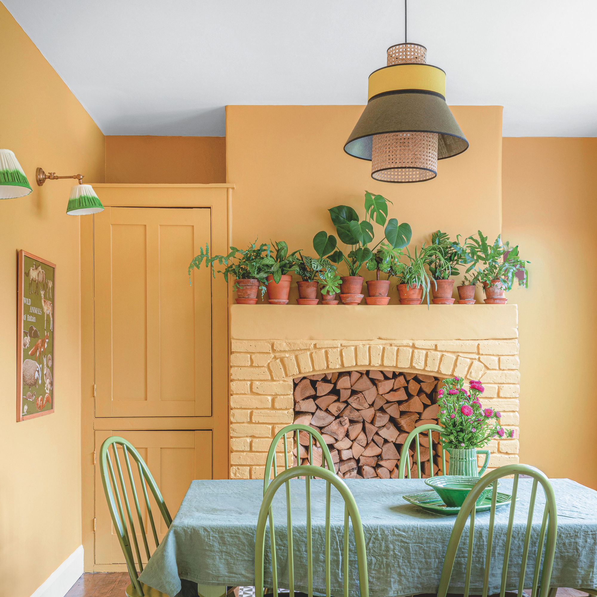 Warm yellow dining room with lots of house plants and white ceiling.
