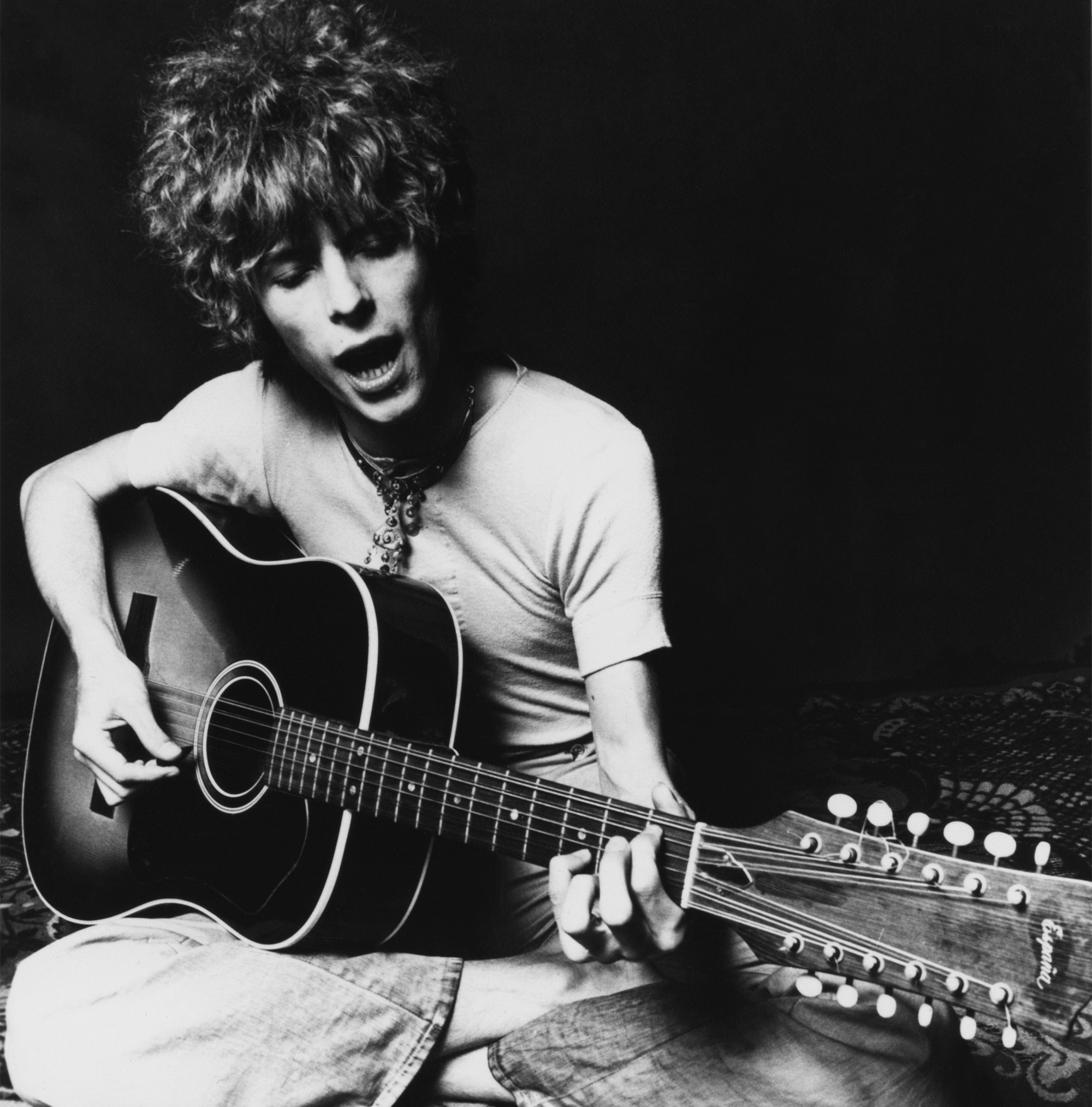 David Bowie plays an acoustic Espana 12-string guitar to promote the release of his album "Space Oddity" in November 1969 in London, England.