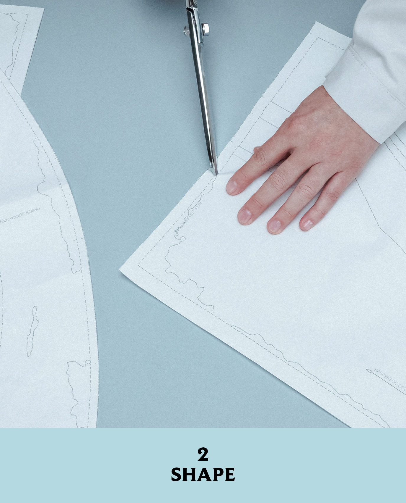 Prada artist cutting pattern for the jacket from Look 10 in its fall/winter 2026 collection.