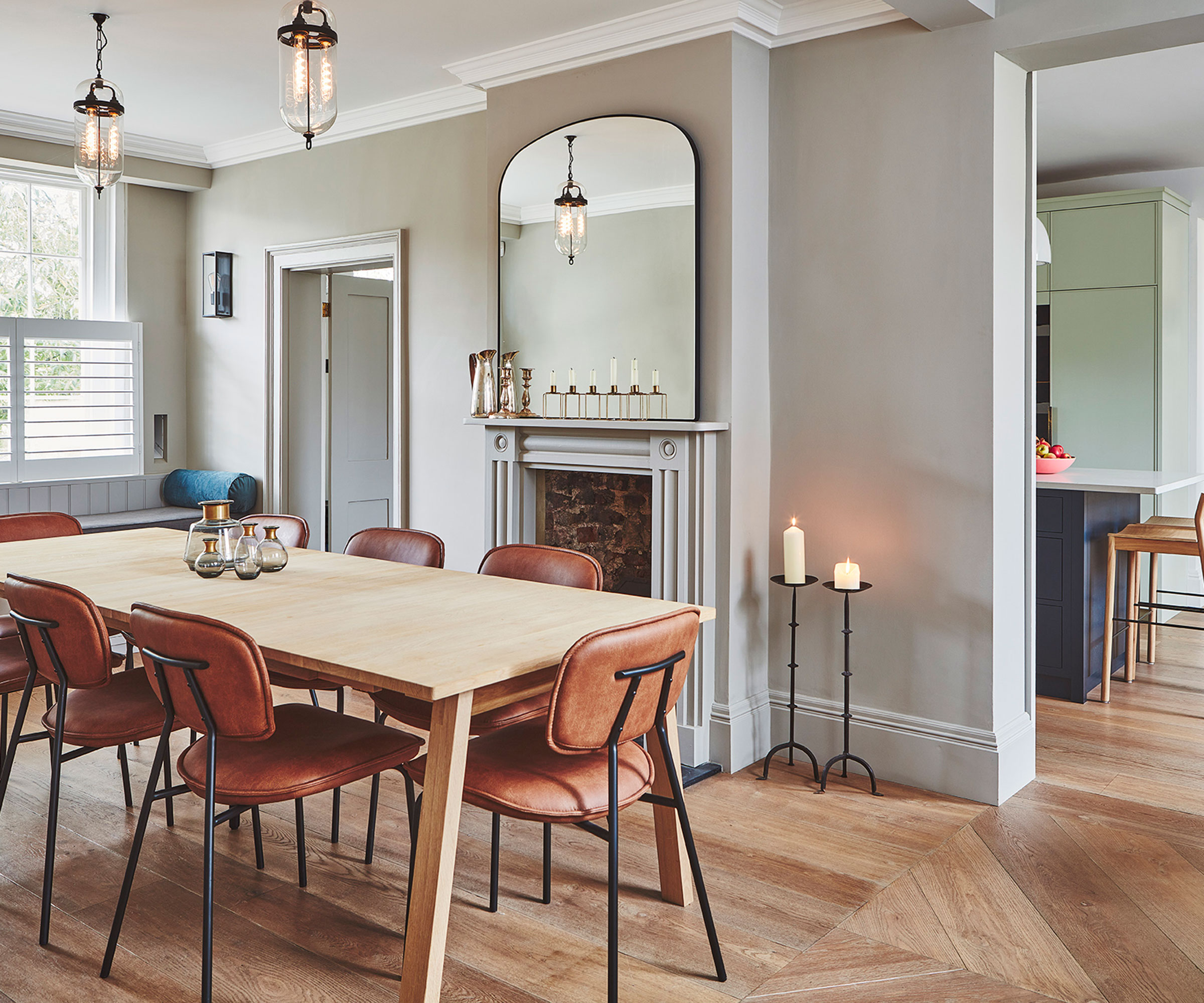 dining room in period house with shutters and wooden flooring with wooden dining table