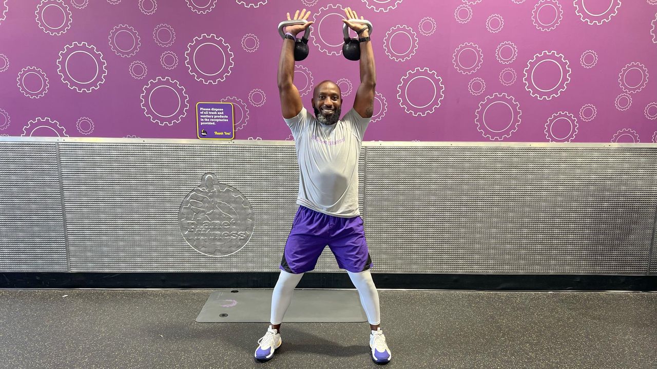 Teddy Savage completing a kettlebell clean to overhead press