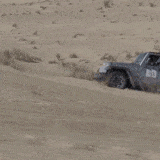 Jeep going up sand dune gif