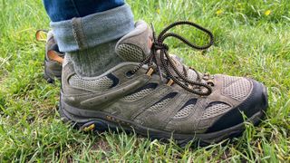 Person wearing chunky Merrell Moab 3 shoes