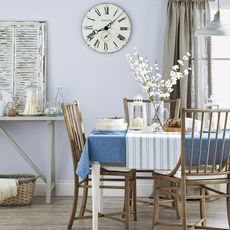 dining room with blue coloured and dining table 