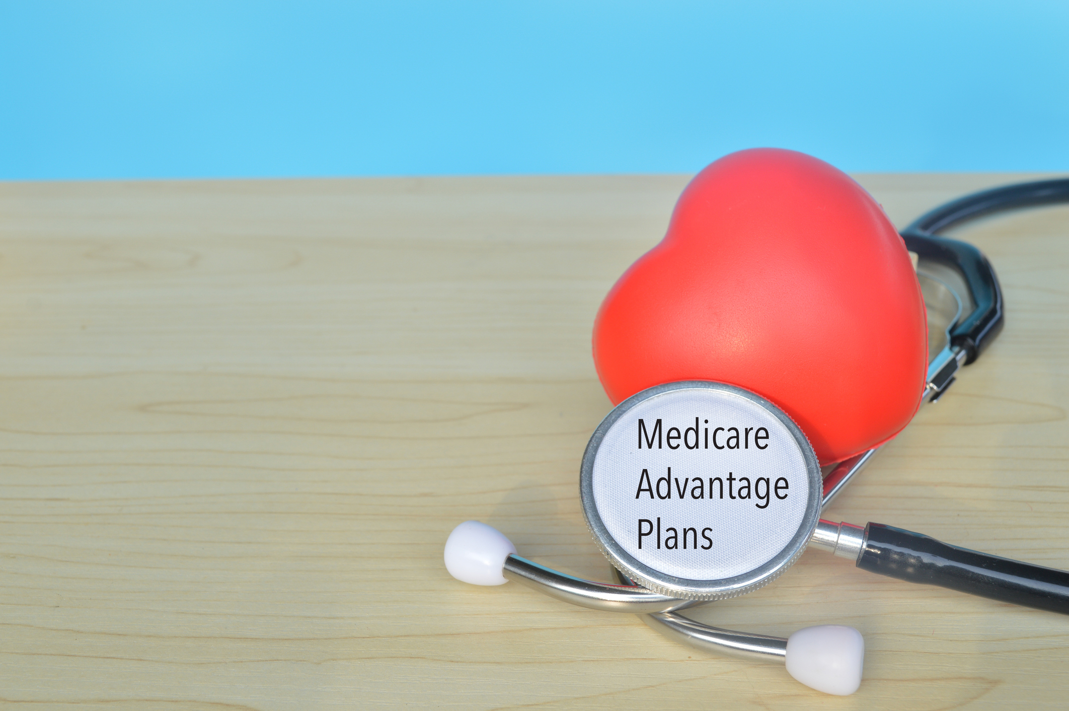 Red heart shape and stethoscope with text MEDICARE ADVANTAGE PLANS