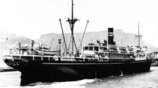 A black and white photo of the SS Montevideo Maru in the water. 