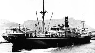 A black and white photo of the SS Montevideo Maru in the water. 