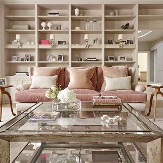 glamorous pink sitting room with sofa cushions silver mirrored table and ruhlman wine tables