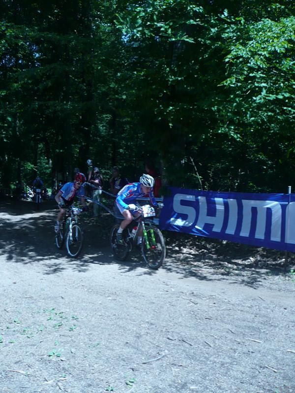 Juniors race one of the few fireroad sections of course, a climb.