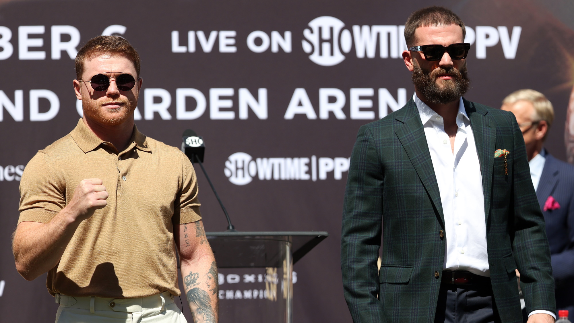 Canelo Alvarez and Caleb Plant posing at a press conference ahead of their fight