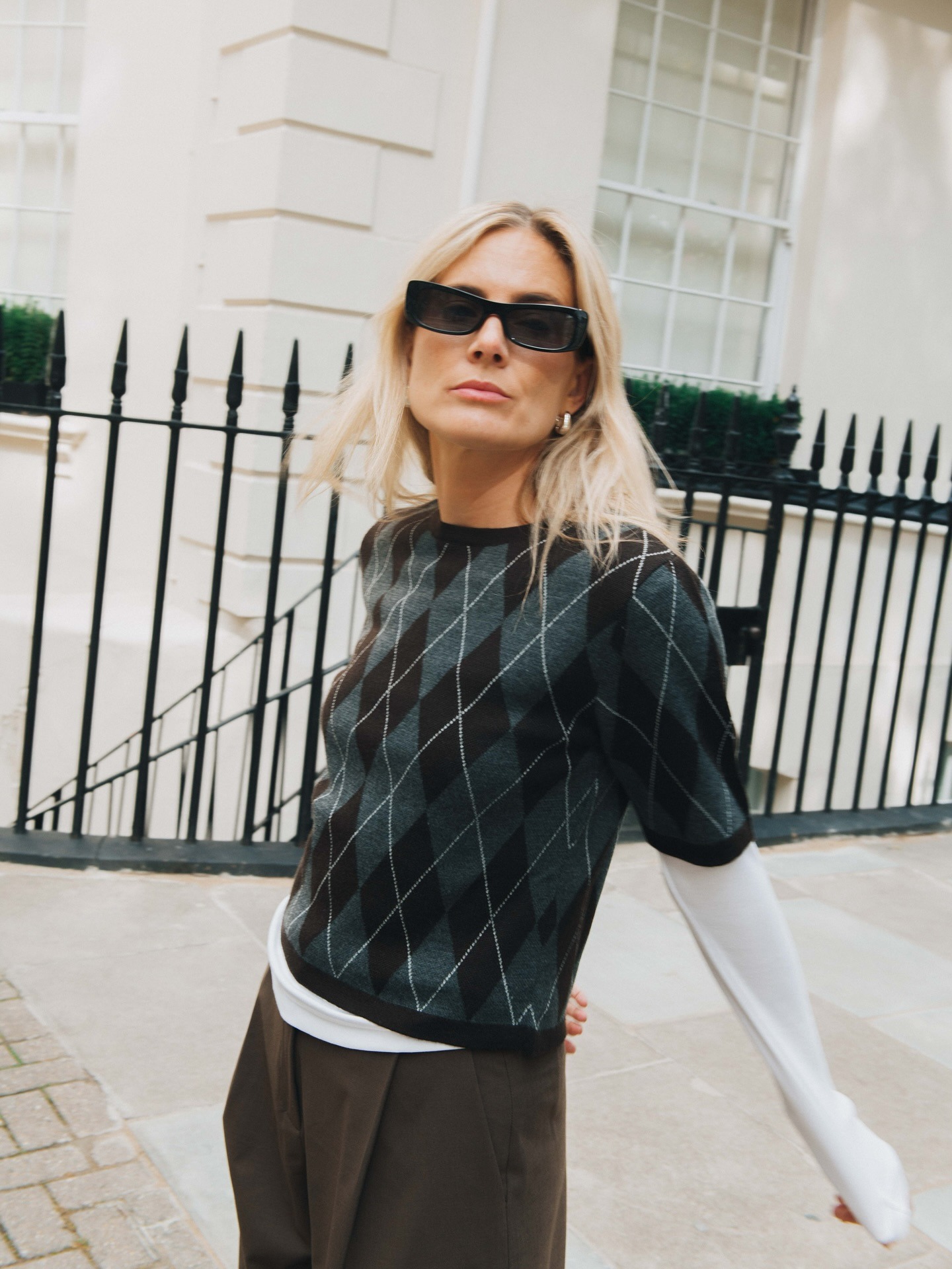 Woman in argyle sweater.