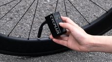 A CYCPLUS Bike Pump being used to inflate a road tyre