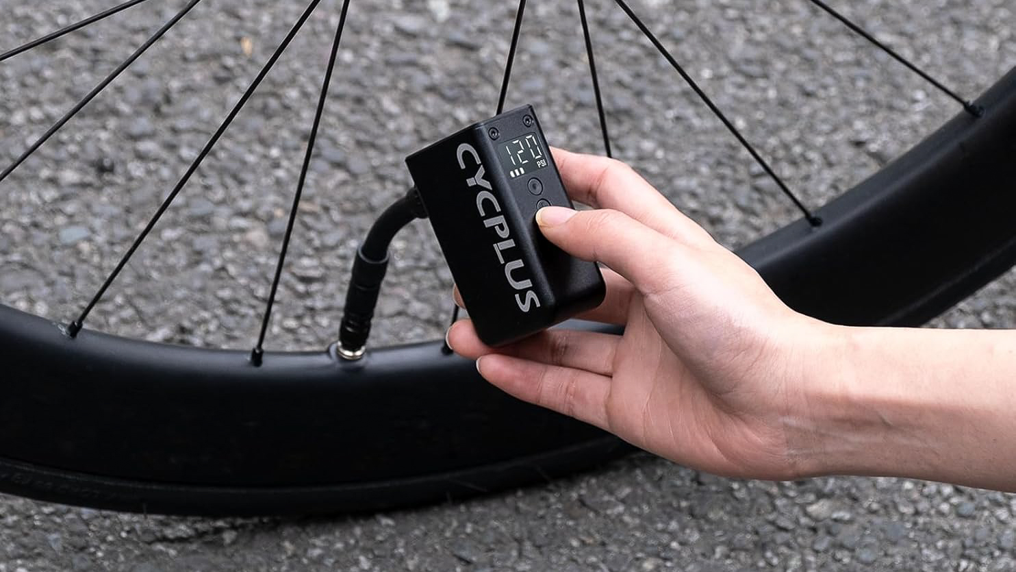 A CYCPLUS Bike Pump being used to inflate a road tyre