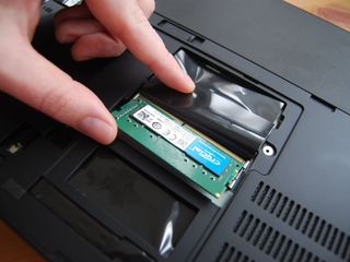 Insert the first RAM module at an angle