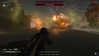 The player watching an explosion while surrounded by dead bugs in Helldivers 2.