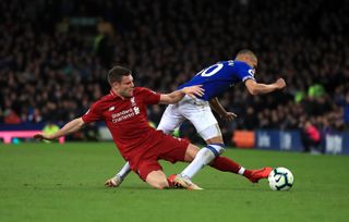 James Milner, left, tackles Everton’s Richarlison