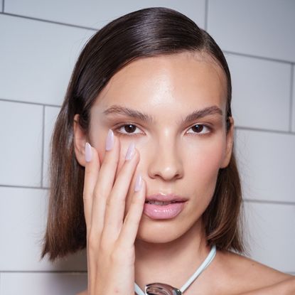 bridal nails against a brides face