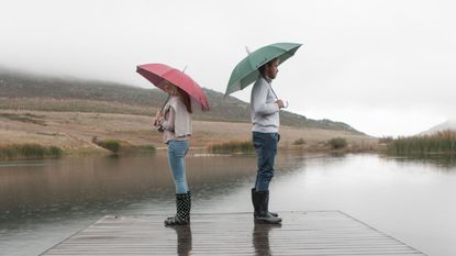 Water, Jeans, Shirt, Umbrella, Leisure, People in nature, Denim, Bank, Reflection, Lake, 