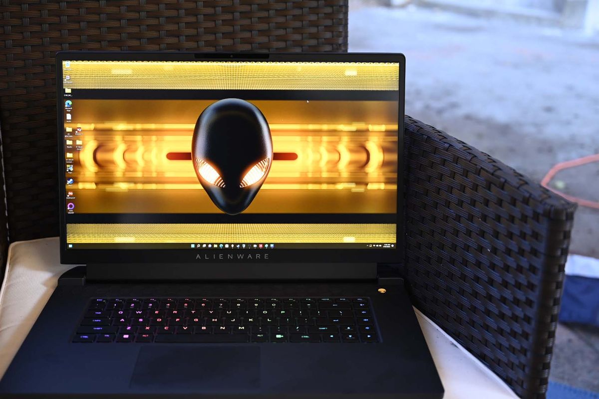 Alienware m17 R5 gaming laptop on a black wicker chair