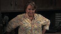 Roseanne Conner (Roseanne Barr) speaks to her husband, Dan, about their daughter's potential pregnancy on Roseanne.