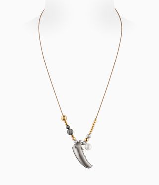 Gold necklace with beads and a silver horn on it