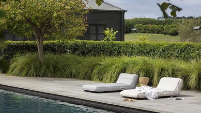 pool floats on poolside with accessories like towels and sandals