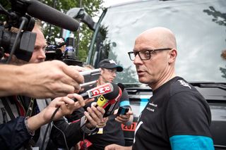 Team Sky's Dave Brailsford talks with members of the media