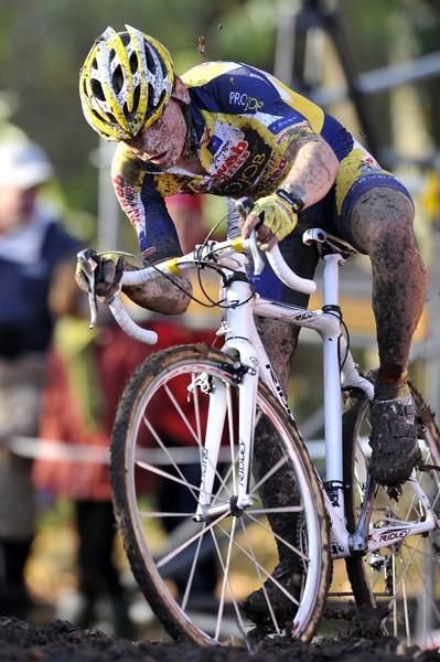 Kenneth Van Compernolle tries to keep his balance in the slick mud.