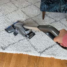 Image of Vax vacuum being used on a rug 
