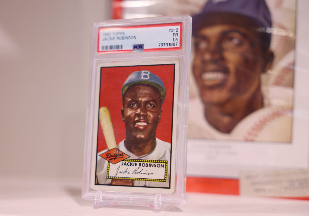 A Jackie Robinson baseball card in a protective case.