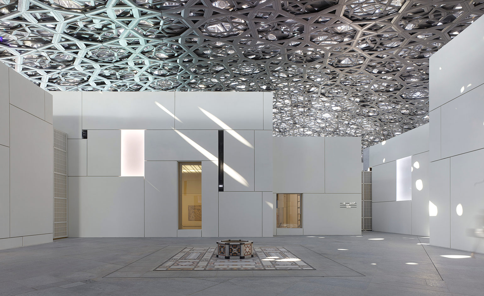White building under layers of aluminium and stainless steel