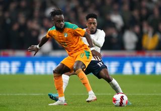 England defender Kyle Walker-Peters, right, came off the bench against Ivory Coast after making his international debut against Switzerland