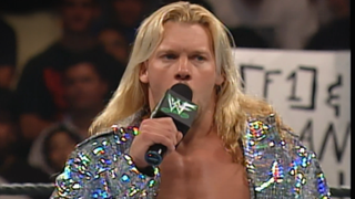 Chris Jericho talking into the microphone while inside the ring at WrestleMania.