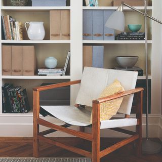 A chair with shelving in the background