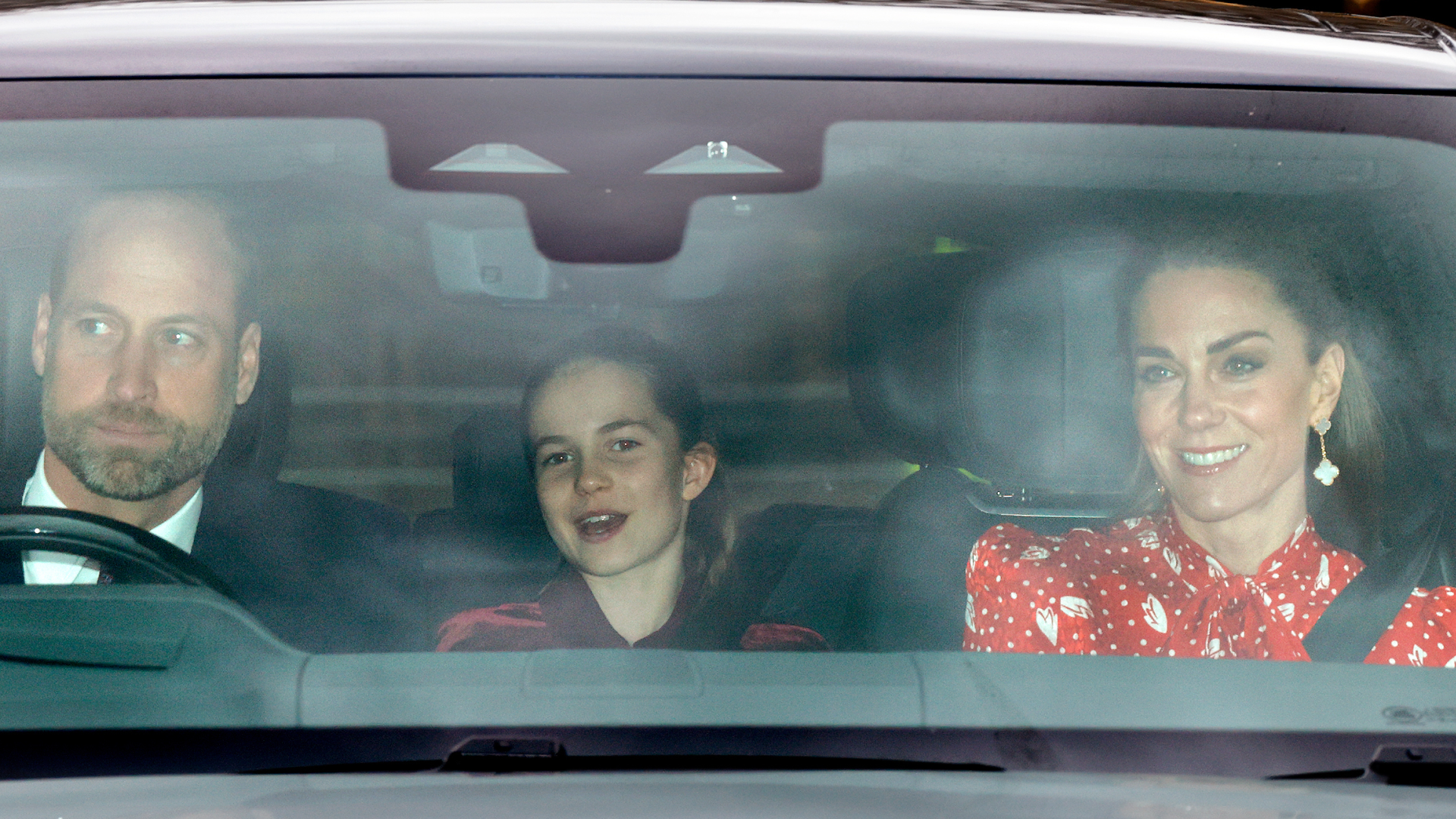 Princess Charlotte and Princess Kate riding in a car with Prince William