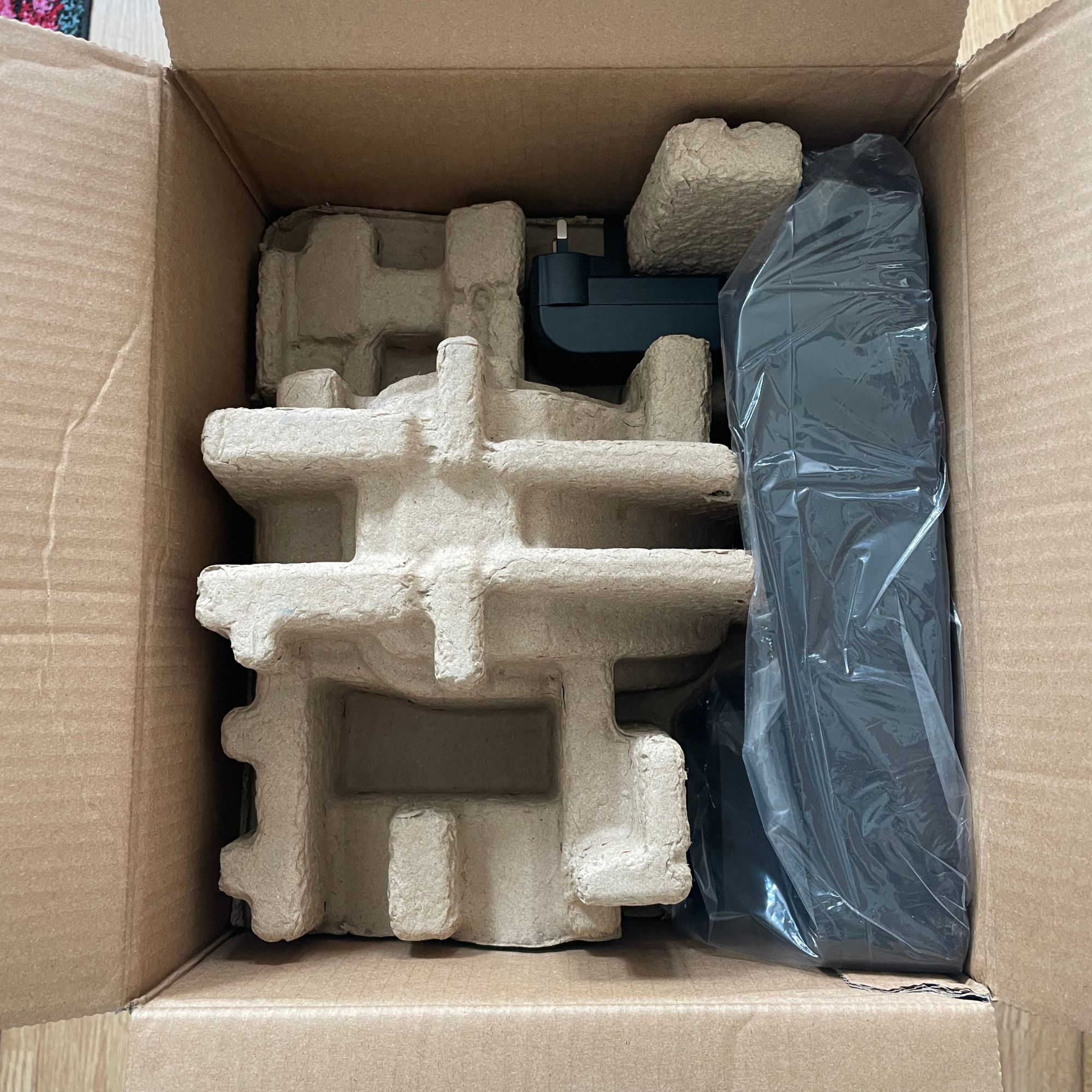 Bissell Crosswave Omniforce Edge box with the lid open, revealing cardboard shell and plastic inside