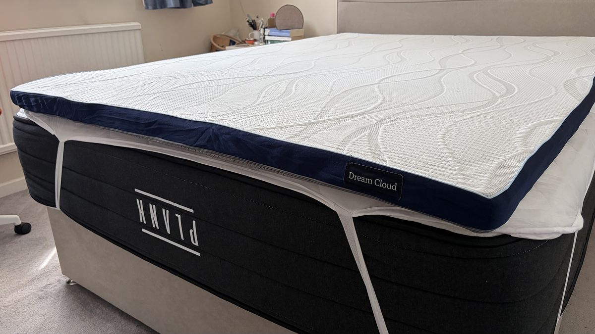 The DreamCloud Softer Mattress Topper on the Plank Firm Luxe mattress in the bedroom of our reviewer