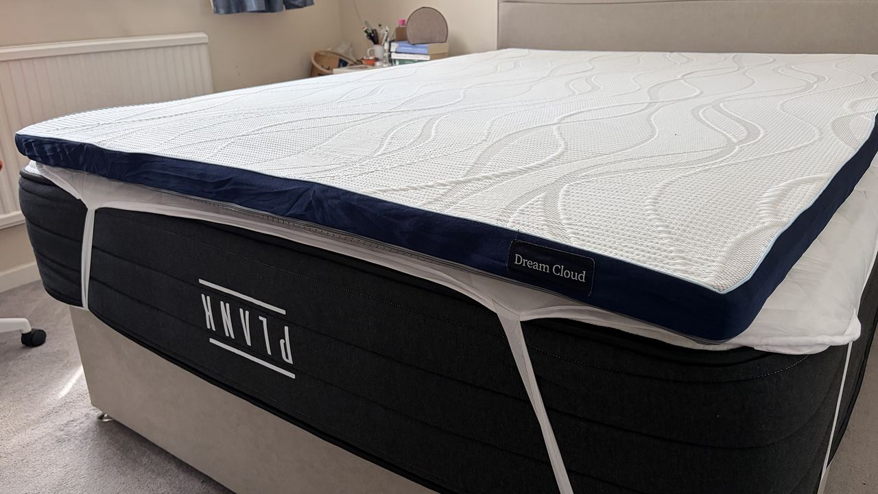 The DreamCloud Softer Mattress Topper on the Plank Firm Luxe mattress in the bedroom of our reviewer