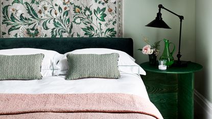 pink and green bedroom with white bedding
